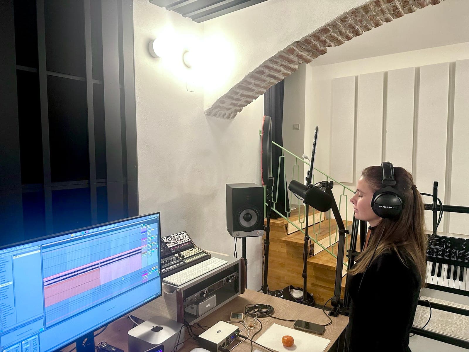 Over the shoulder onto the screen with the recording running.